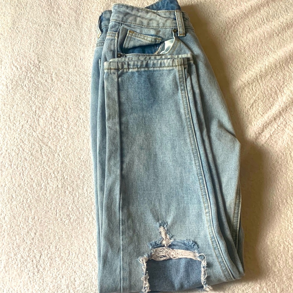 Buttoned front ripped jeans